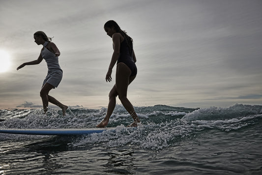 KaneSkennar Photographer-Girls surfing on twilight after dark