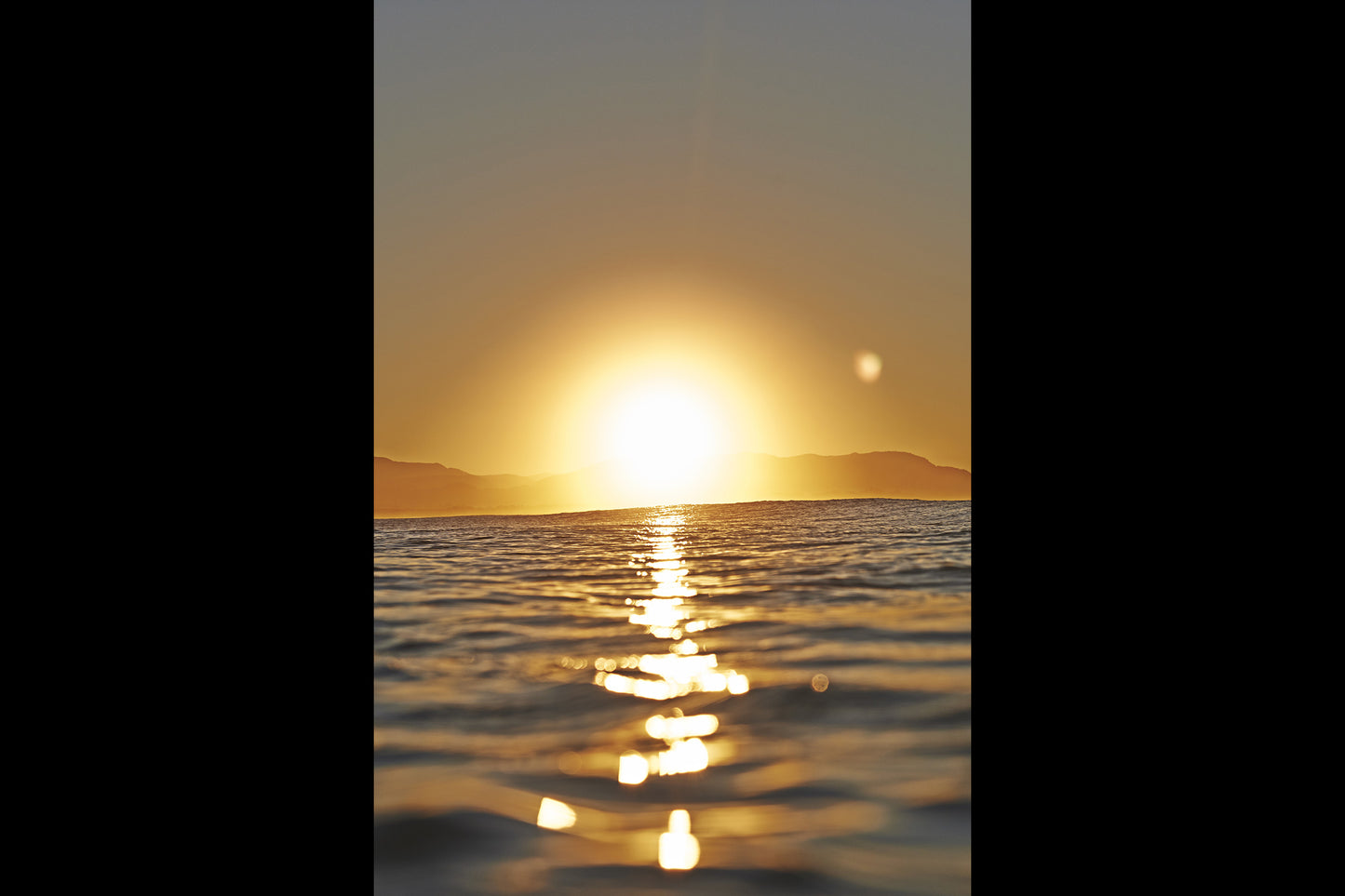 KaneSkennar-Afternoon mood light over the bay looking towards Mt Chincogan